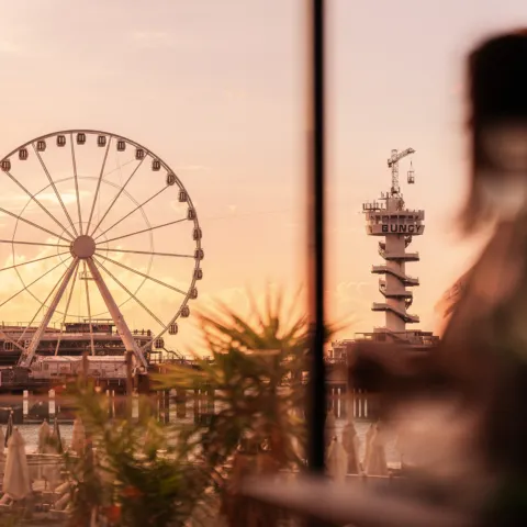 Girl next to the ferris wheel at Scheveningen