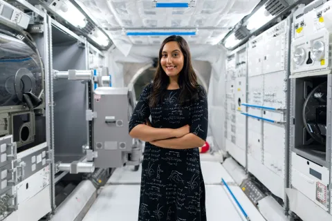 Woman in aerospace cleanroom