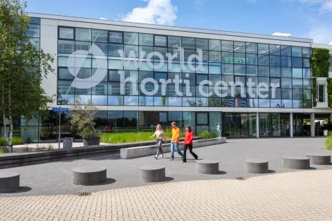 People walking outside World Horti Center