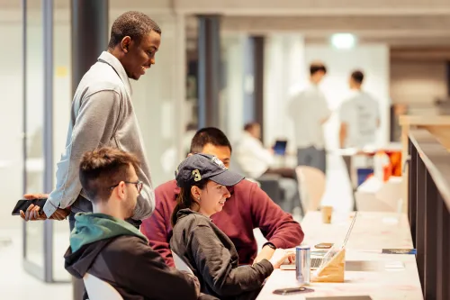 Group of students behind a computer