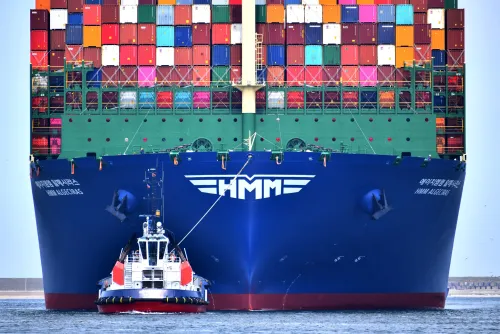 Tug with a large vessel