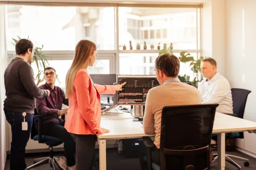 Group of employees behind computers