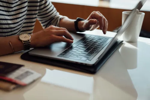Woman typing on a computer