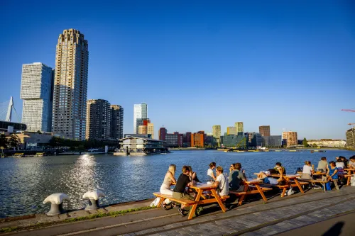 Skyline of Rotterdam with people on terraces