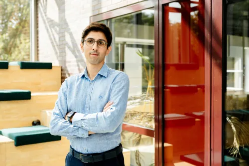 Portrait of a man in office with sunlit background