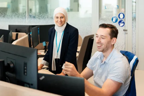 Man and woman collaborating in office
